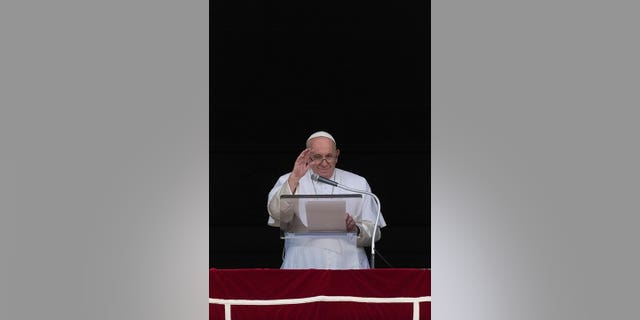 Pope Francis delivers his blessing as he recites the Angelus noon prayer from the window of his studio overlooking St.Peter's Square, at the Vatican, Sunday, Sept. 11, 2022. 