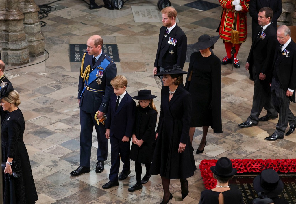 Britain's Prince William, Kate, Princess of Wales, Prince Harry, Meghan, Duchess of Sussex, Prince George and Princess Charlotte at the Westminster Abbey on the day of Queen Elizabeth II funeral, in London Monday, Sept. 19, 2022. (Phil Noble/Pool Photo via AP)