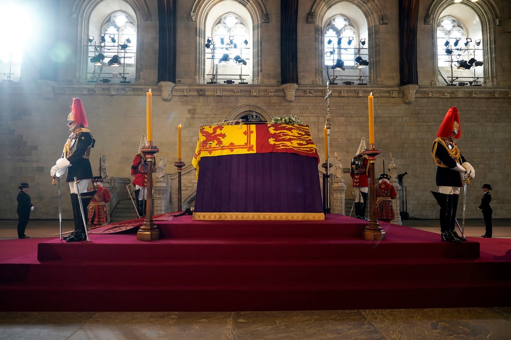 Queen Elizabeth II lies in state in an empty Palace of Westminster Hall.