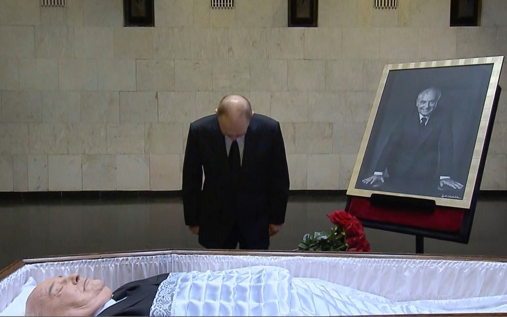 Putin is seen bowing his head before Gorbachev's body at the Central Clinical Hospital in Moscow.
