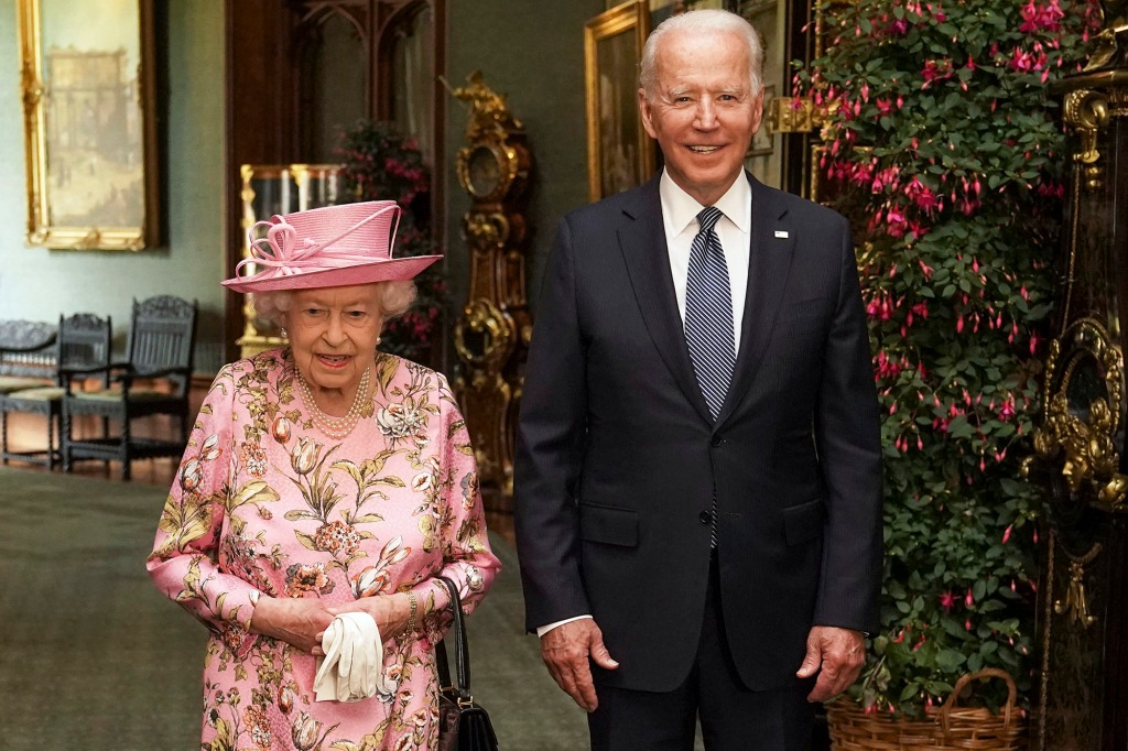 Queen Elizabeth II with US President Joe Biden in the Grand Corridor during their visit to Windsor Castle on June 13, 2021.