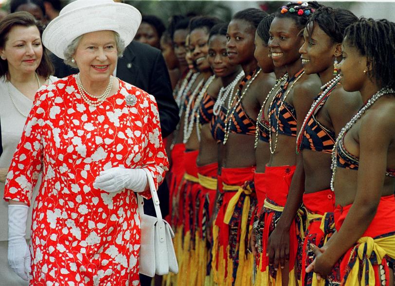 After she opened a Trade and Investment Exhibition at the Polana Hotel in Maputo, Mozambique, Queen Elizabeth smiled as she walked past traditional dancers from the National Song and Dance group in 1999.