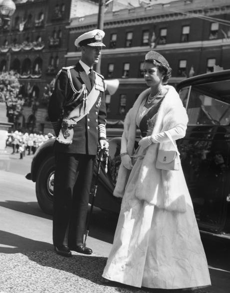 Queen Elizabeth, wearing a silk gown and a diamond tiara, walked into the State Opening of the Parliament ceremony in Melbourne, Australia, in 1954.