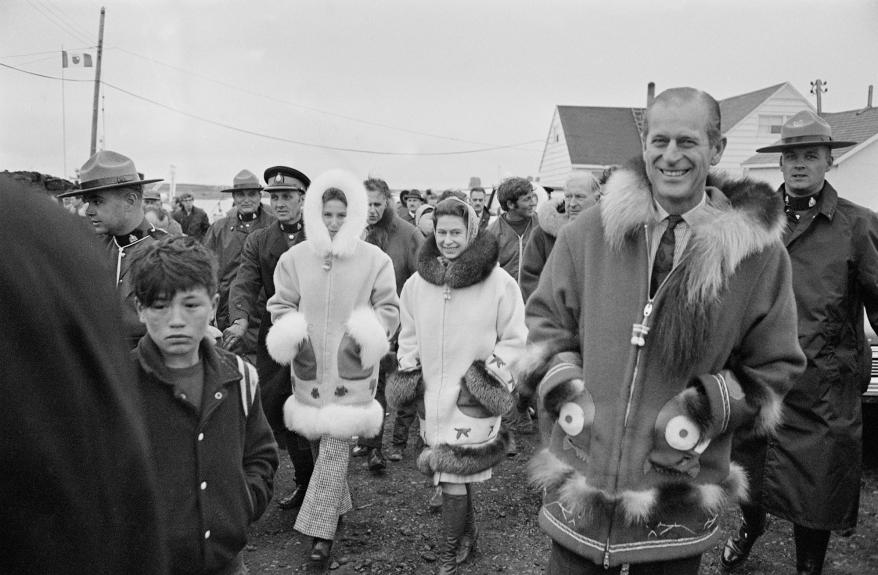 Queen Elizabeth, Prince Philip and Princess Anne bundled up in Tuktoyaktuk, one of the Northwest Territories of Canada, to view the midnight sun in 1970.