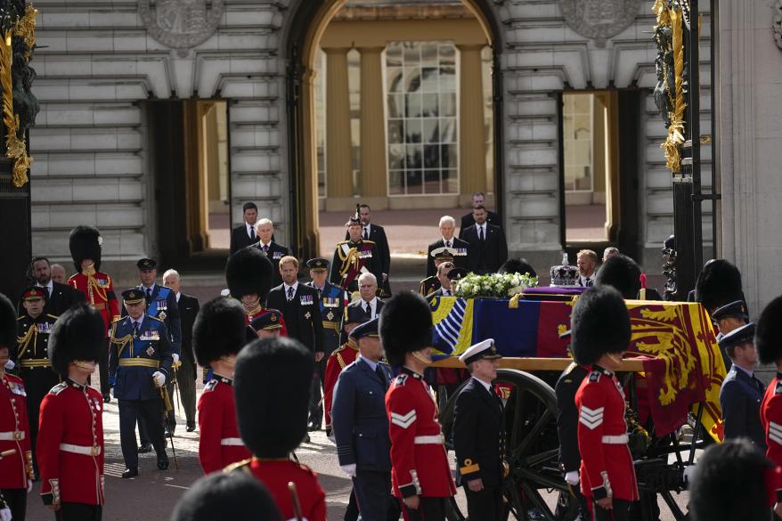 Members of the royal family walking behind Queen Elizabeth's funeral.