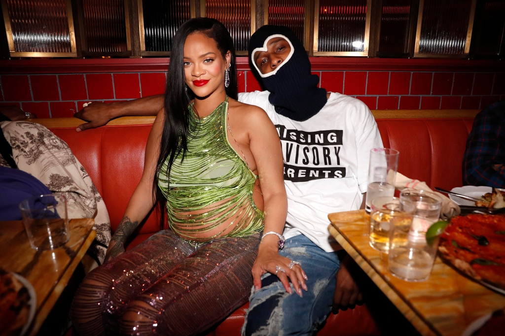 Rihanna in a green dress poses with A$AP Rocky in a ski mask.