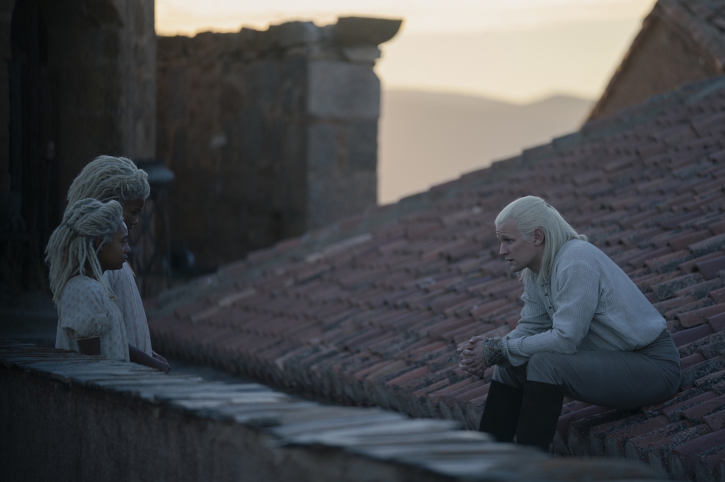 Daemon sits on a roof looking at his daughters on "House of the Dragon." 