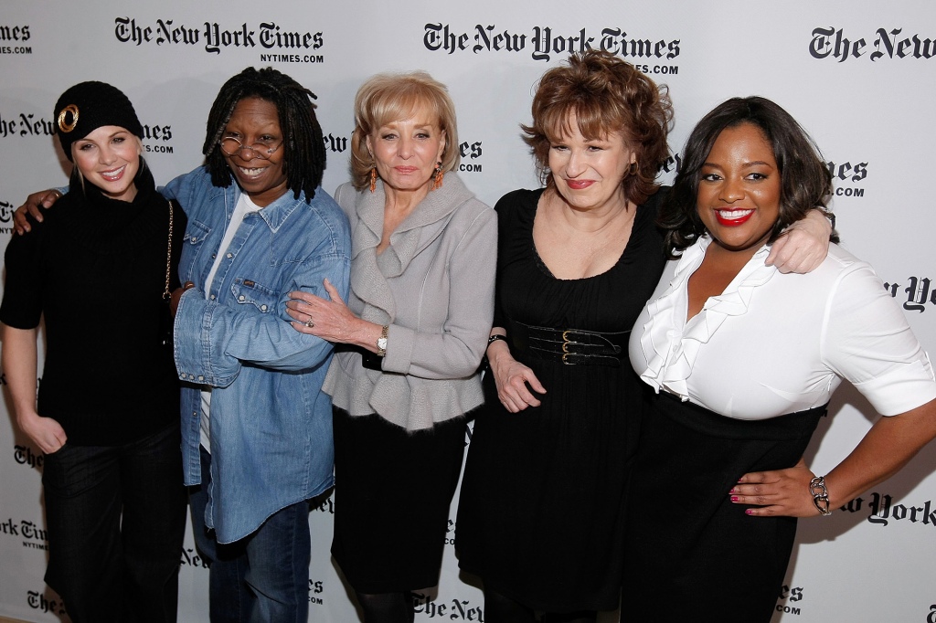 Elisabeth Hasselbeck, Whoopi Goldberg, Barbara Walters, Joy Behar and Sherri Shepherd (right) stand in a line smiling. 