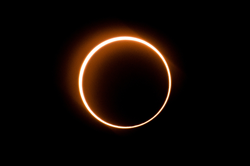 The moon moves in front of the sun in a rare "ring of fire" solar eclipse as seen from Tanjung Piai, Malaysia.