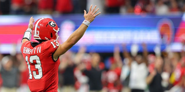 Stetson Bennett #13 of the Georgia Bulldogs reacts after their first touchdown against the Oregon Ducks during the first quarter of the Chick-fil-A Kick-Off Game between Oregon and Georgia at Mercedes-Benz Stadium on September 03, 2022 in Atlanta, Georgia.