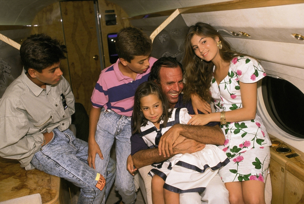 Iglesias (holding young Falcó) is the actual father of her half-siblings Julio Jr. (far left), Enrique and Chabeli. 