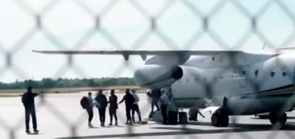 Migrants get off plane in Martha's Vineyard last week.
