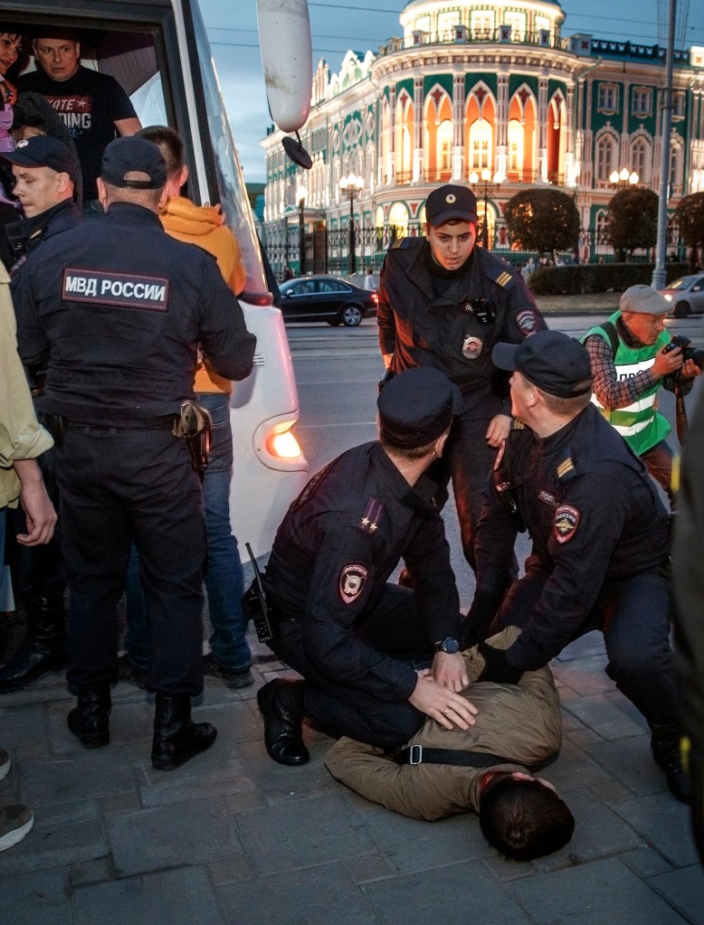 Police detain a demonstrator during a protest against mobilization in Yekaterinburg, Russia.