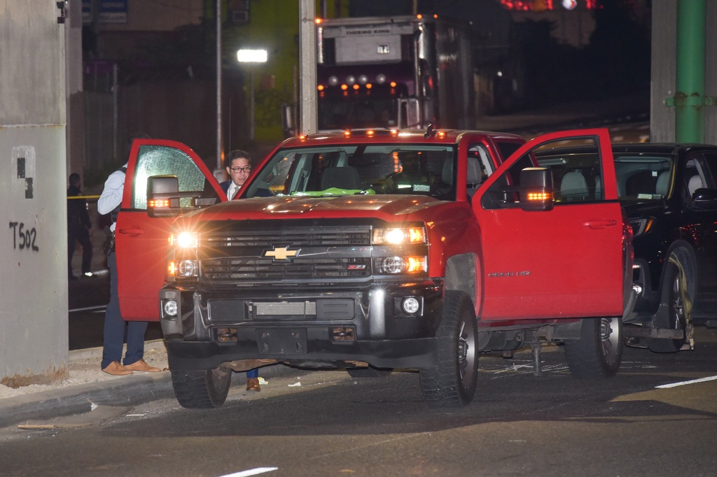 Police at the scene examining the truck