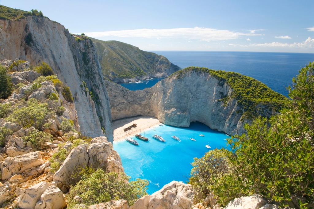 View from clifftop over the turquoise waters of Navagio Bay.