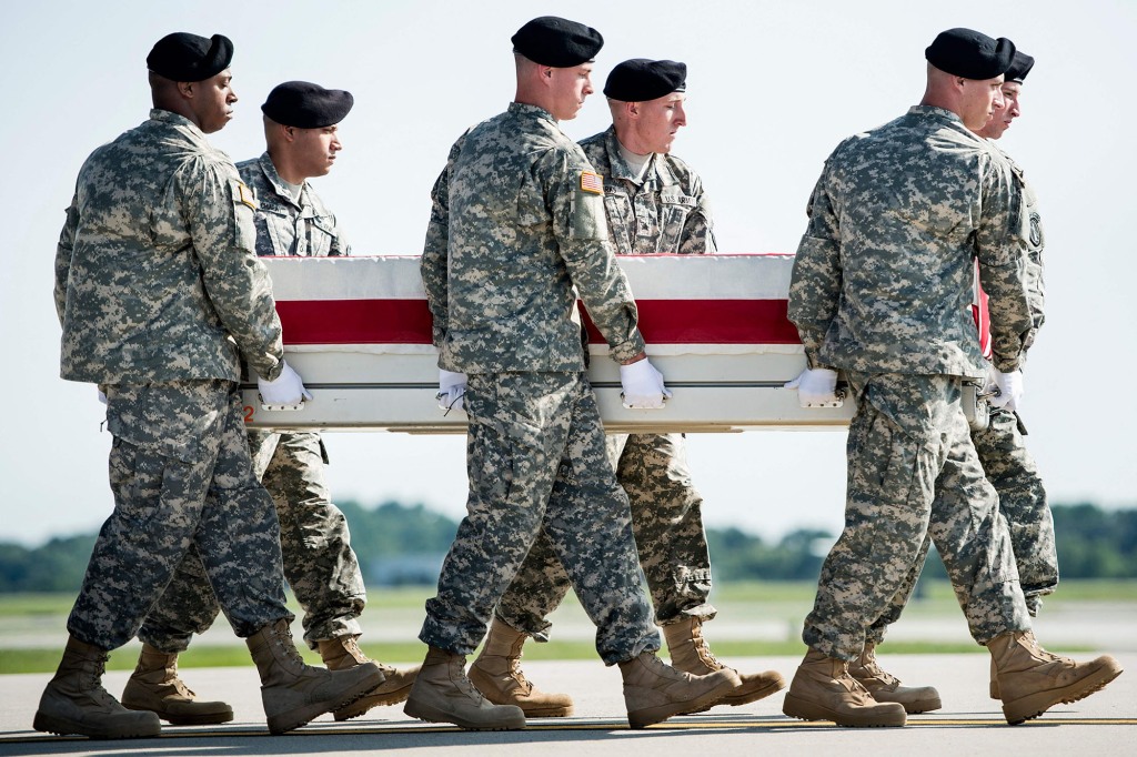 Soldiers carry a coffin of an Army major killed in Afghanistan. 