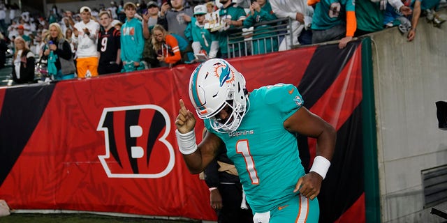 Miami Dolphins quarterback Tua Tagovailoa runs onto the field before a game against the Cincinnati Bengals Thursday, Sept. 29, 2022, in Cincinnati. 