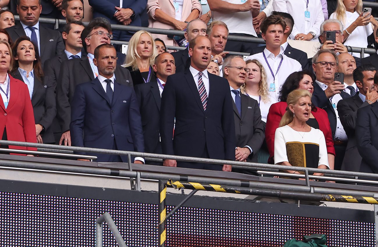 Prince William (center) is pictured singing the national anthem at a soccer match in July.