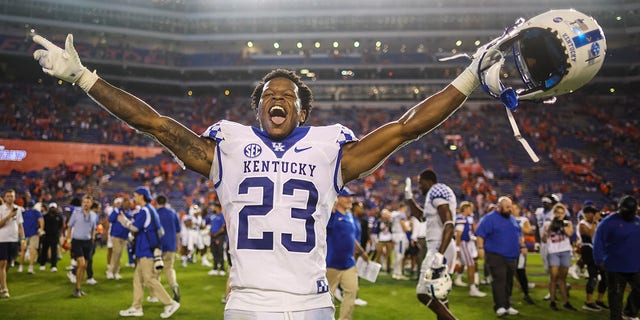 Andru Phillips #23 of the Kentucky Wildcats celebrates after defeating the Florida Gators 26-16 in a game at Ben Hill Griffin Stadium on September 10, 2022 in Gainesville, Florida.