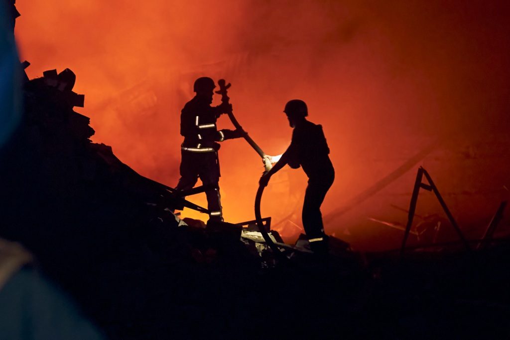 Ukrainian State Emergency Service firefighters work after a rocket attack in Kramatorsk, eastern Ukraine, Saturday, Aug. 3, 2022. (AP Photo/Kostiantyn Liberov)