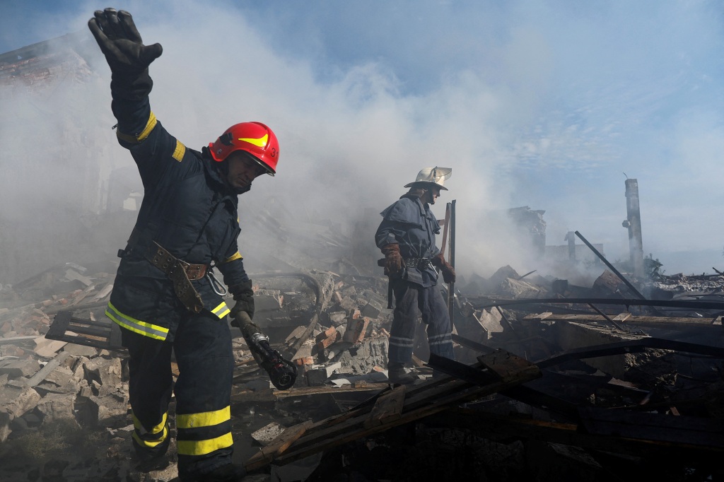 Ukrainian firefighters put out fire in a destroyed wholesale market after a Russian strike in Kramatorsk.