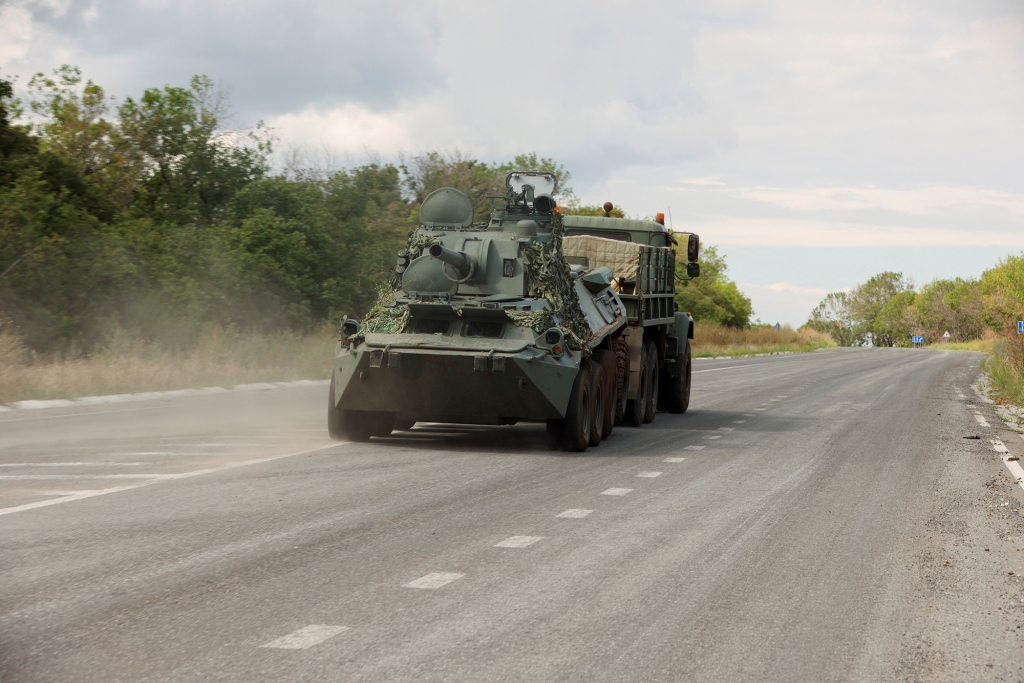 Ukrainian forces drive out of Bakhmut in eastern Ukraine on Monday.