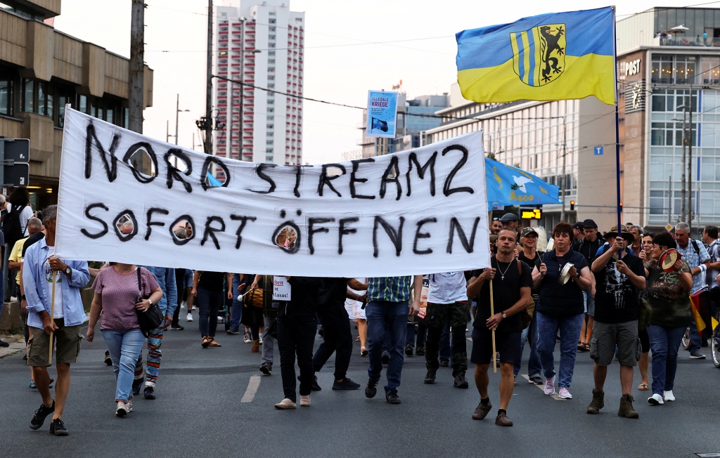 Right-wing activists hold up a banner reading "Open Nord Stream 2 immediately" during a protest against increasing energy prices and rising living expenses in Leipzig, Germany.