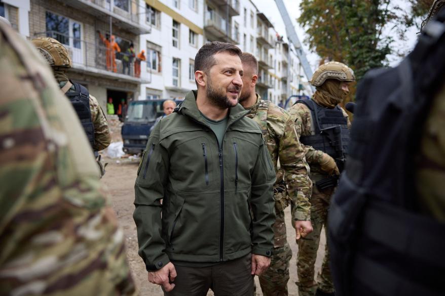 A picture of Ukrainian President Zelensky with soldiers.