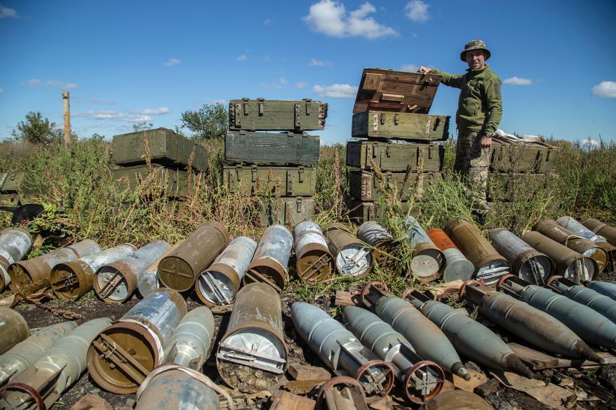 A Ukrainian soldier collects ammunition left by Russian troops in Izium, Ukraine.
