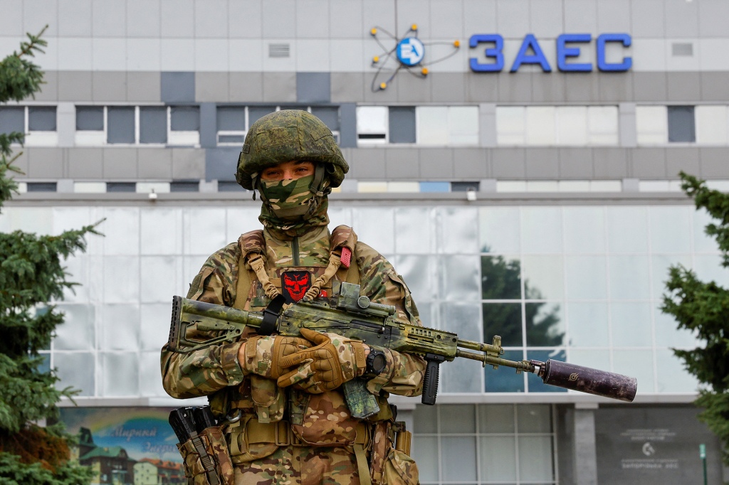 A soldier stands guard near the Russian-controlled Zaporizhzhia following the arrival of the International Atomic Energy Agency expert mission.