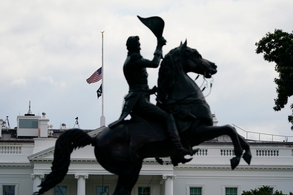 With the equestrian statue of President Andrew Jackson in Lafayette Park in the foreground, the American flag flies at half-staff over the White House, Thursday, Sept. 8, 2022