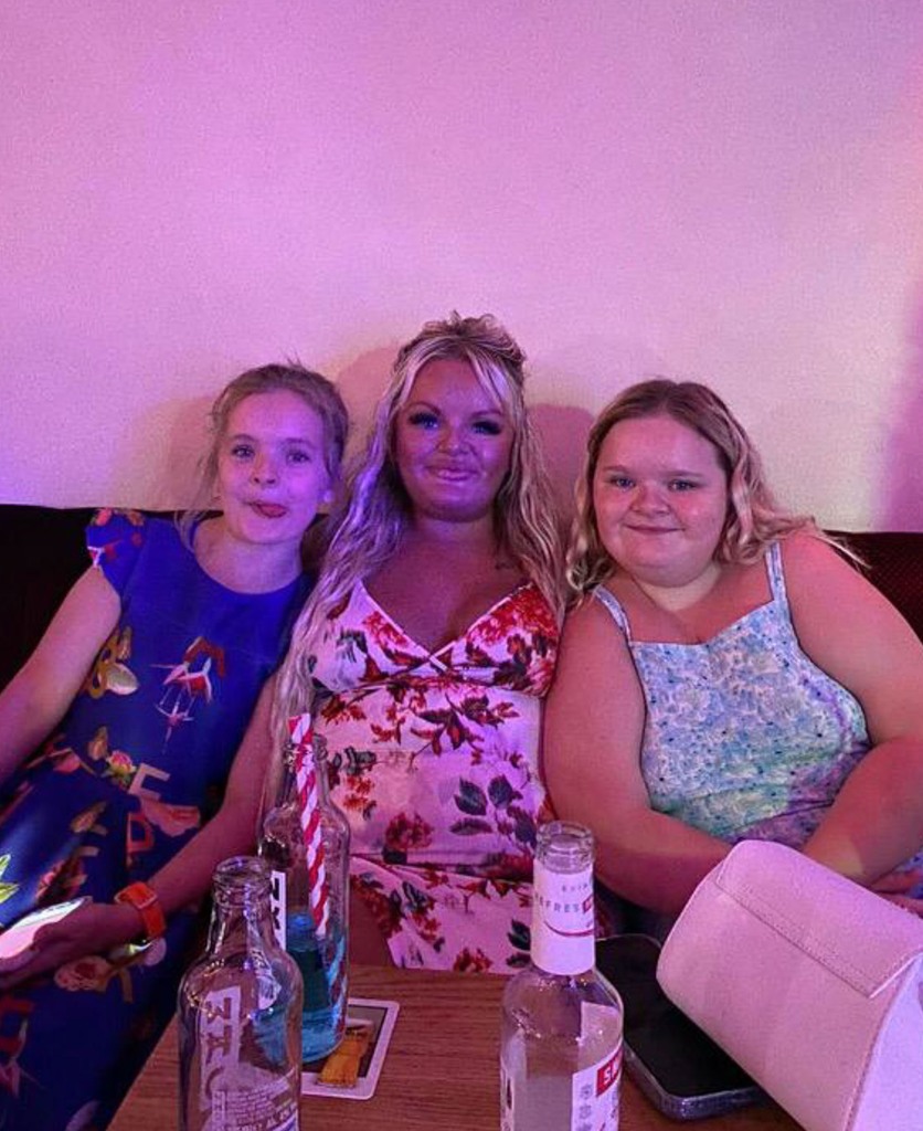 Lewis (middle) was initially worried about passing the condition along to her daughters as she was "bullied" growing up.