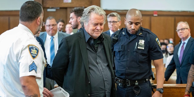 Former Trump White House strategist Steve Bannon is handcuffed as he enters a New York state court in Manhattan. He pled not guilty to  charges related to the "We Build the Wall" fundraiser. September 8, 2022