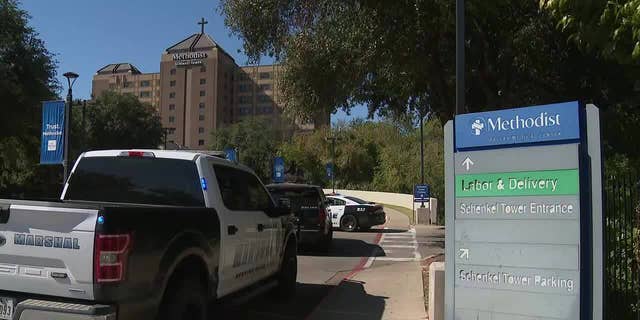 Law enforcement outside of Methodist Dallas Medical Center in Texas. Two employees were shot on Saturday morning.