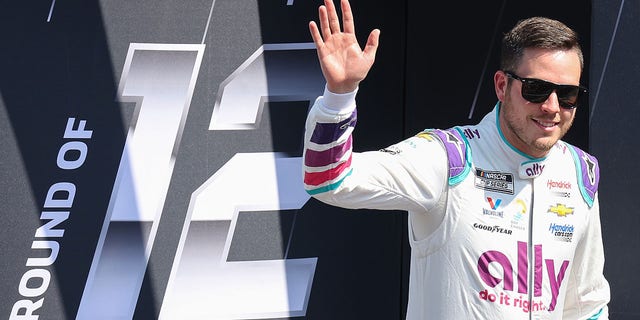 Alex Bowman, driver of the #48 Ally Chevrolet, waves to fans walks onstage during driver intros prior to the NASCAR Cup Series Auto Trader EchoPark Automotive 500 at Texas Motor Speedway on Sept. 25, 2022 in Fort Worth, Texas.