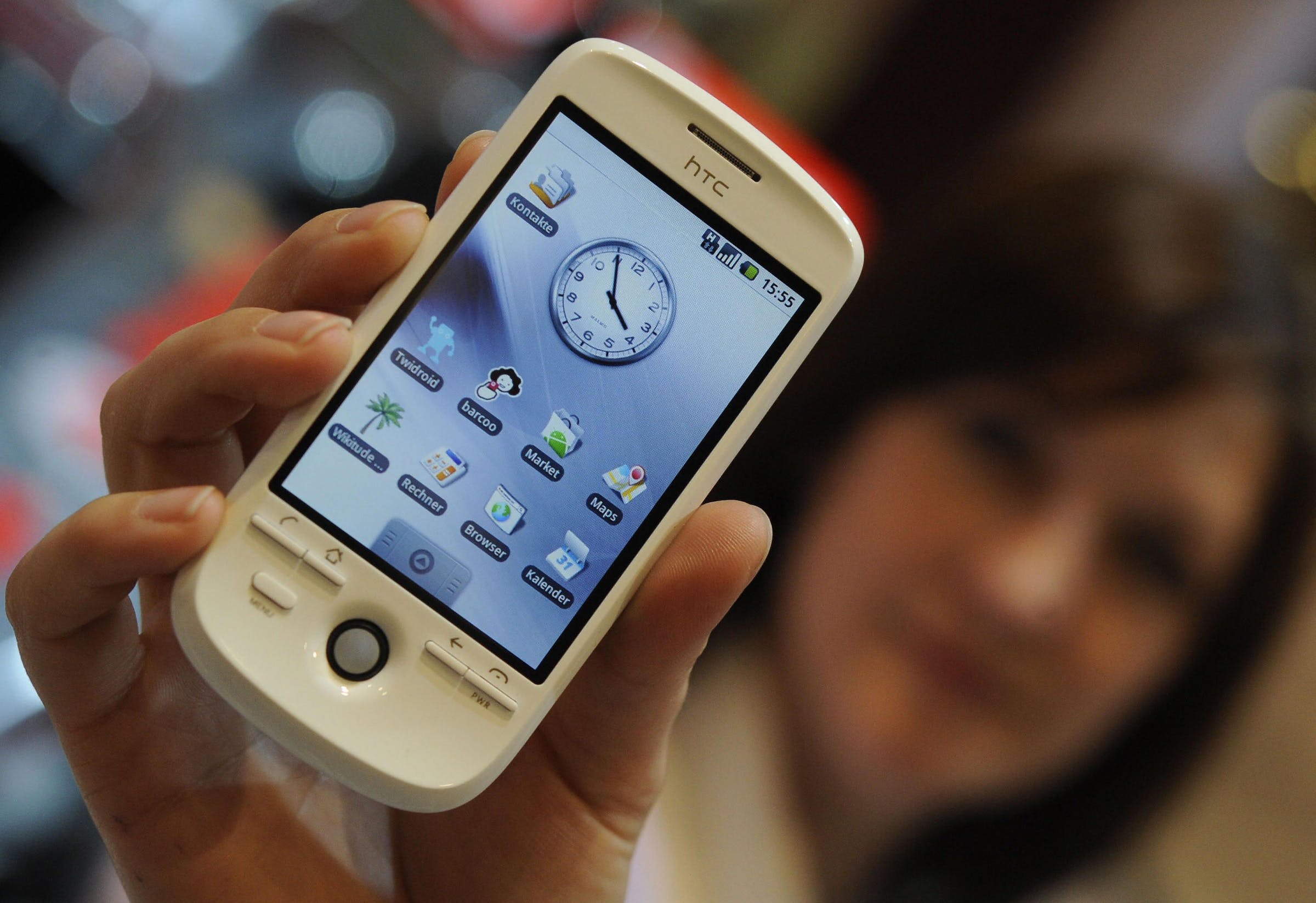 A woman presents Vodafone’s Smartphone H