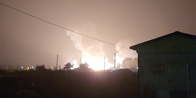 Flames and smoke rise from a military airbase Wednesday, Oct. 5, 2022, in Gangnueng, South Korea. South Korea’s Joint Chiefs of Staff said no injuries were reported from the explosion which involved a short-range Hyumoo-2 missile. (Kim Hee Soo via AP)