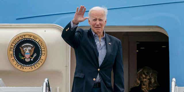 President Joe Biden waves before boarding Air Force One for a trip to Florida to visit areas impacted by Hurricane Ian, Wednesday, Oct. 5, 2022, at Andrews Air Force Base, Maryland.