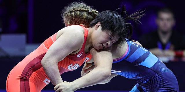 Masako Furuichi (RED) of Japan in action against Amit Elor (BLUE) of USA during the Womens Free Style World Wrestling Championship Semi finals match at Stark Arena on September 14, 2022, in Belgrade, Serbia. 