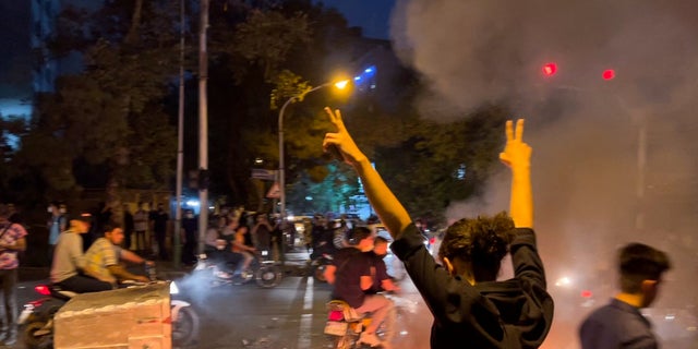 A man gestures during a protest over the death of Mahsa Amini, a woman who died after being arrested by the Islamic republic's "morality police", in Tehran, Iran September 19, 2022. (West Asia News Agencyv ia REUTERS)