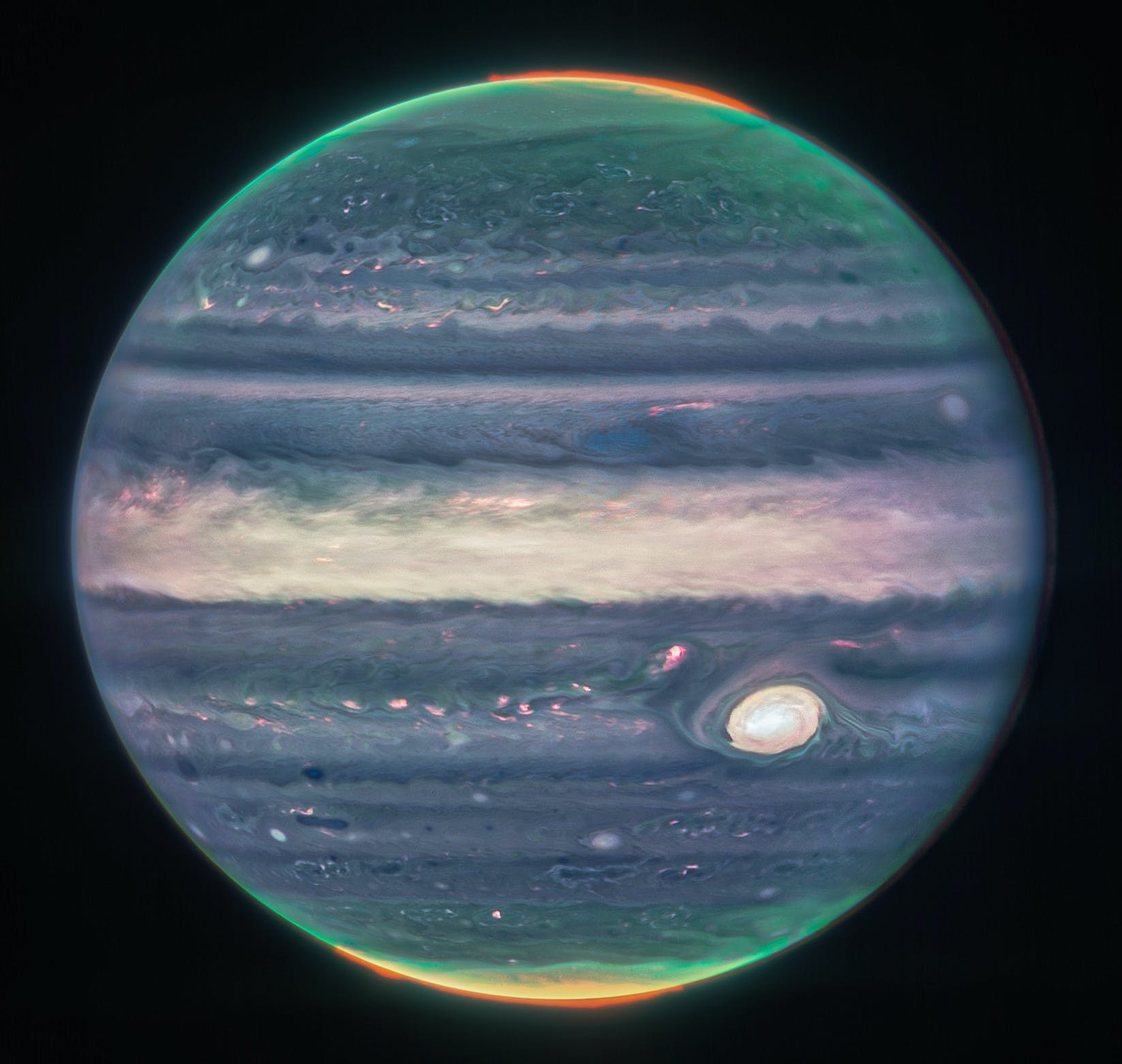 An image of jupiter in which the great red spot appears white.