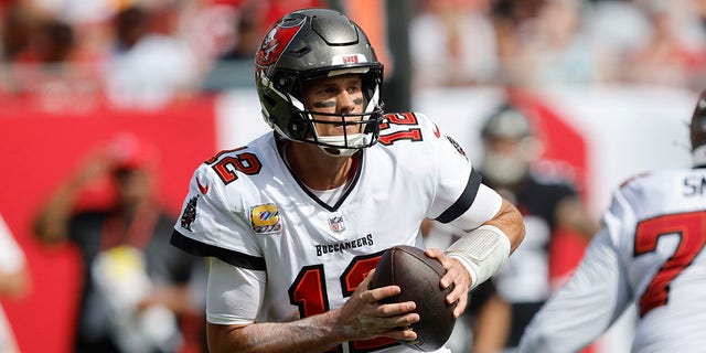 Tampa Bay Buccaneers Quarterback Tom Brady (12) looks for an open receiver during the regular season game between the Atlanta Falcons and the Tampa Bay Buccaneers on Oct. 9, 2022 at Raymond James Stadium in Tampa, Florida. 