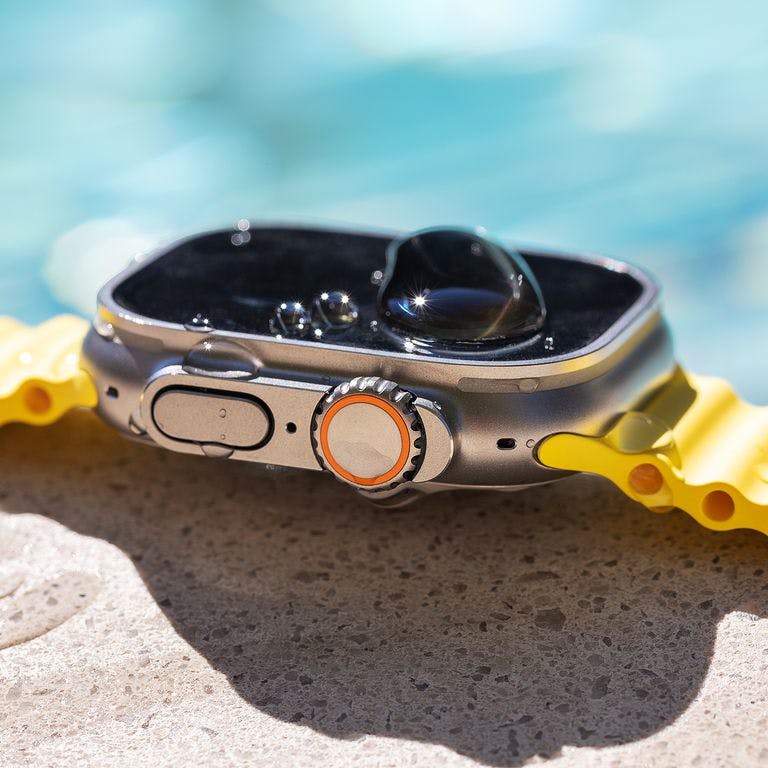 Side view of Apple Watch with Ocean band at the pool