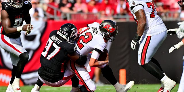 Grady Jarrett of the Atlanta Falcons sacks Tom Brady of the Buccaneers at Raymond James Stadium on Oct. 9, 2022, in Tampa, Florida.