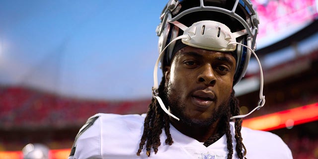 Davante Adams, #17 of the Las Vegas Raiders, warms up before kickoff against the Kansas City Chiefs at GEHA Field at Arrowhead Stadium on Oct. 10, 2022 in Kansas City, Missouri.