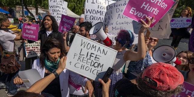 Pro-life and pro-choice activists argue during the Women's March Action Rally for Reproductive Rights at Mariachi Plaza in Los Angeles, California, on Oct. 8, 2022.