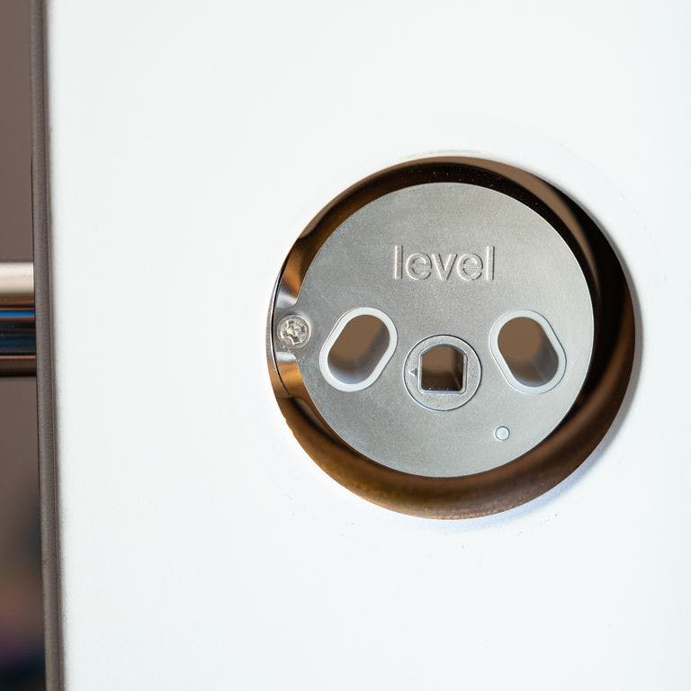 The Level Lock smart lock in a door frame