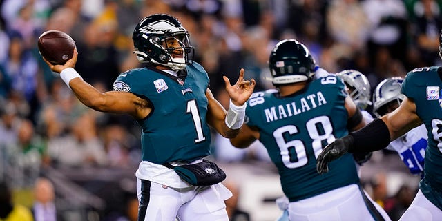 Philadelphia Eagles' Jalen Hurts looks to pass during the first half of an NFL football game against the Dallas Cowboys on Sunday, Oct. 16, 2022, in Philadelphia. 