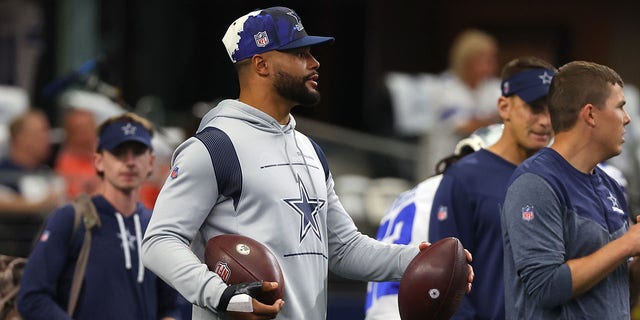 Dak Prescott #4 of the Dallas Cowboys looks on during warmups before the game against the Cincinnati Bengals at AT&amp;amp;T Stadium on Sept. 18, 2022 in Arlington, Texas. 