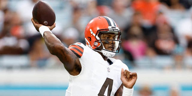 Cleveland Browns quarterback Deshaun Watson, #4, looks to throw the ball during the first quarter of a preseason game against the Jacksonville Jaguars at TIAA Bank Field in Jacksonville, Florida, Aug. 12, 2022.